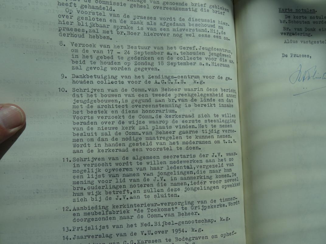 Foto van notulen in boek